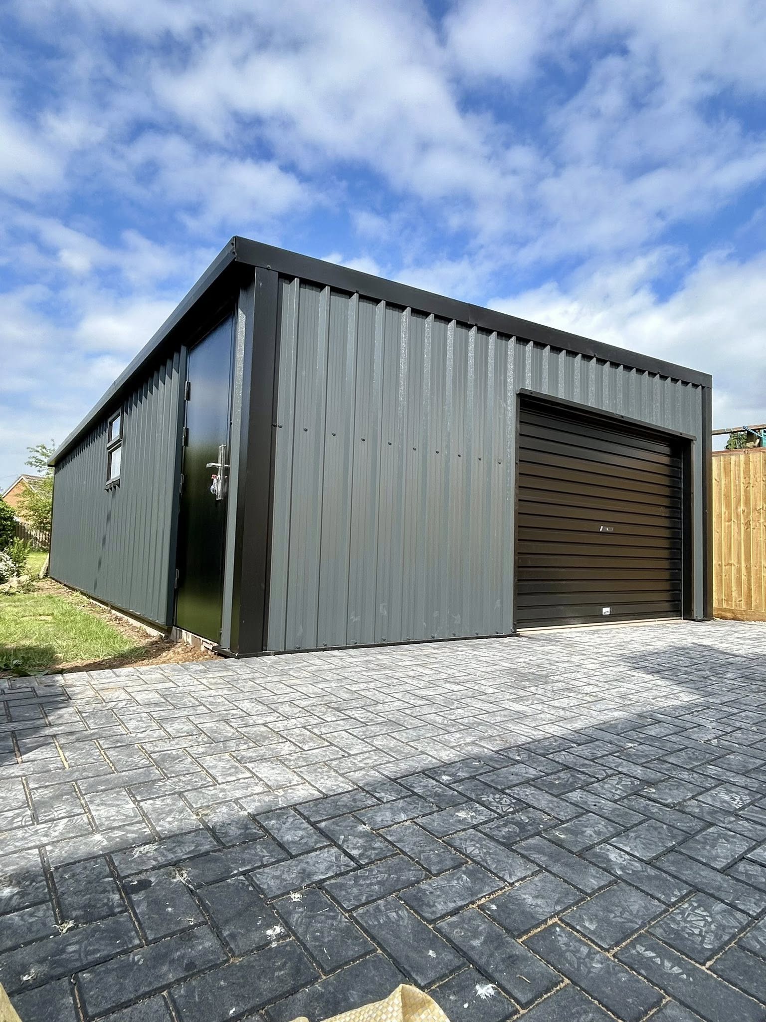 angular shed sloped on roof both sides have garage doors
