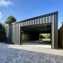 angular shed sloped on roof both sides have garage doors
